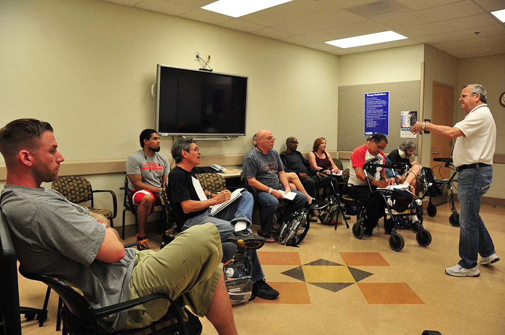 Peer Support Specialist DeWayne Raulerson routinely shares his personal story of recovery with fellow Veterans at the Tucson VA.  Photo by Clifford Baser