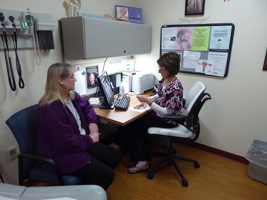 Air Force Veteran Ann Kaya talks with Carrie Champion, LPN, during a recent appointment in the Women’s Wellness Clinic at the Iron Mountain VA Medical Center. 