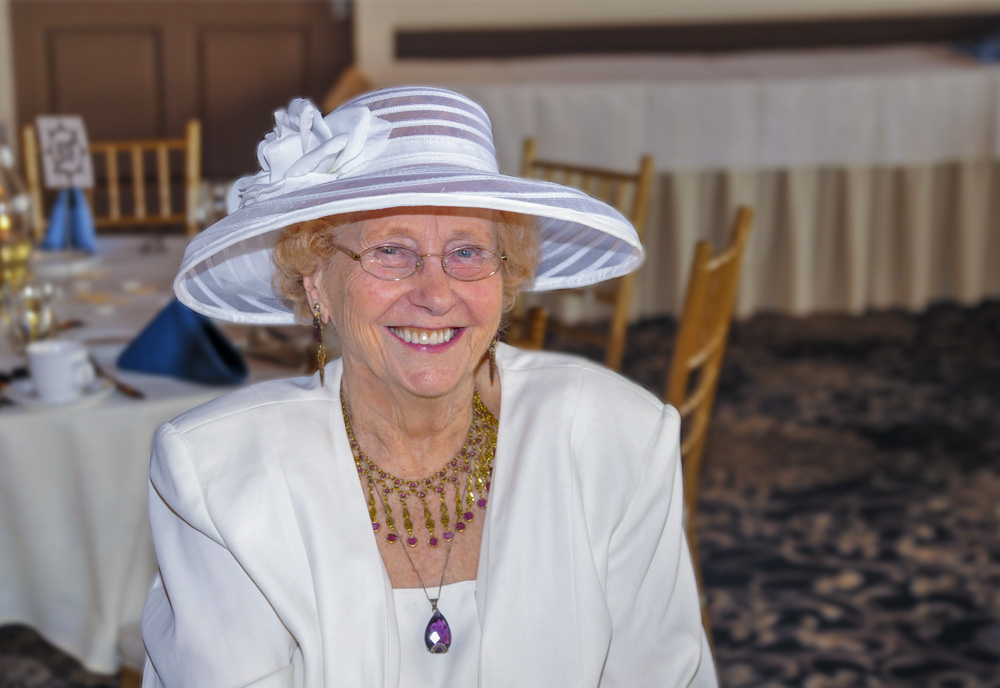 Volunteer Kay Arnold sitting in a banquet room