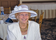 Volunteer Kay Arnold sitting in a banquet room