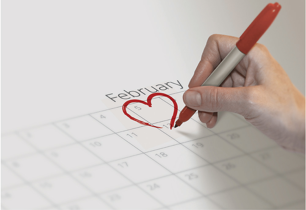 A woman marking the calendar in February, for Heart Health Month