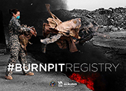Image of female Airman tossing old uniforms into a firepit to be burned