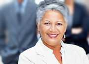 A woman with graying hair smiles
