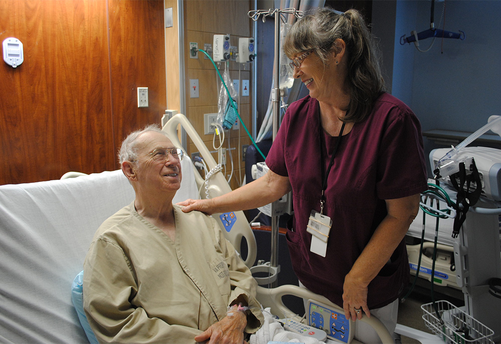 VA Nurse and patient talking