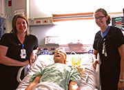 VA nurses Heather Frank (L) and Jill Jefferson along with Simulator SAM during  ICU simulation training at the VA medical center in Des Moines, Iowa.