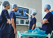 Surgeons looking at x-rays of patient