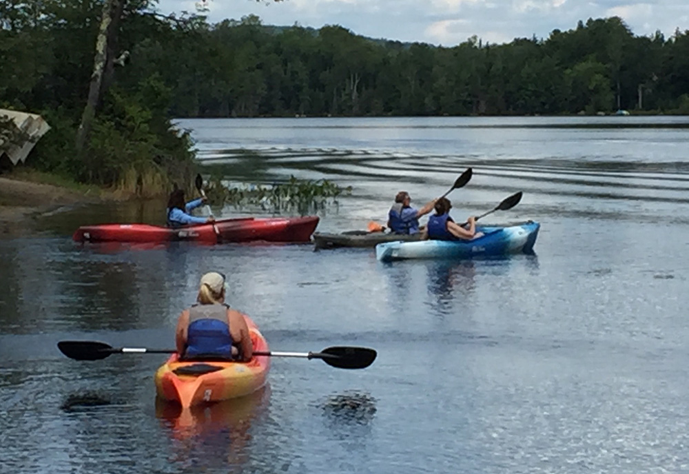 Women Veterans on the lake in canoes