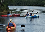 Women Veterans on the lake in canoes