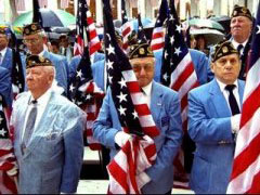 Veterans holding American flags