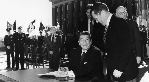President Ronald Reagan signing bill to make VA a cabinet-level department
