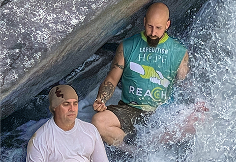 Veteran Peer Facilitators Rodolpho Barrios and Frankie Perez practice mindfulness meditation using the river as a tool for present moment awareness.
