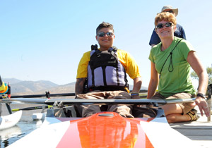 Mentors prepare a Veteran for kayaking