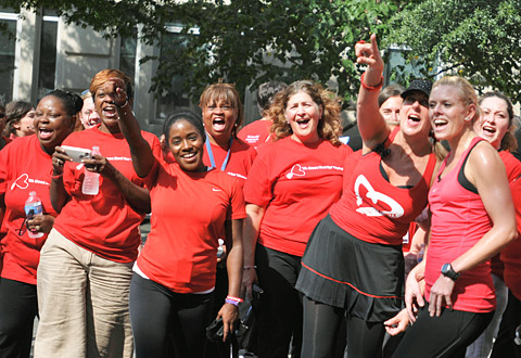 A group of women wearing red cheering