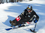 Disabled Veteran skiing on snow covered mountain