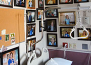 Walls of a patient bedroom with pieces of art and memorobilia