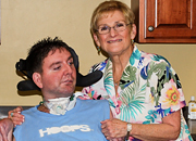 

Woman with disabled man in wheelchair

