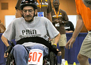 man in wheelchair and obstacle course