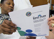 a woman patient holds a brochure