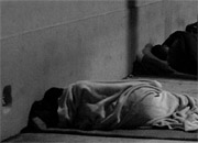 homeless people sleep on a Miami sidewalk