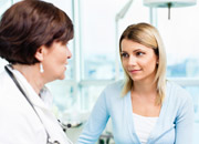 Woman patient talks with a doctor