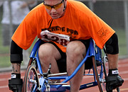 Man in a wheelchair racing on a track