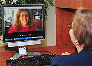 a female healthcare provider interacting with a female patient via Telehealth