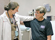 Woman doctor hugs a patient