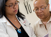 A woman doctor talks to a woman patient