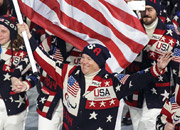 Team USA Paralympics athletes parade with a US flag