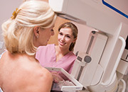 Health tech helps a woman getting a mammogram