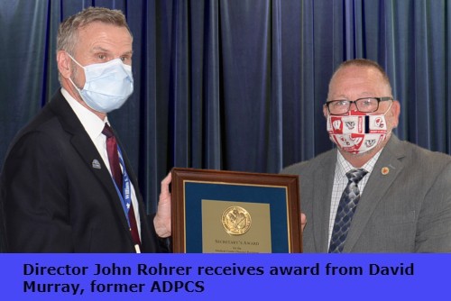 Director John Rohrer receives award from  former ADPCS David Murray