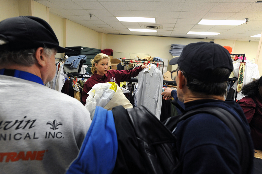 A volunteer prepares to distribute clothes to homeless Veterans during a Washington D.C. VA Medical Center Winterhaven Veteran stand down.