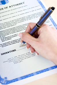 person signing a legal document