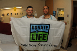 two men holding a Donate Life sign