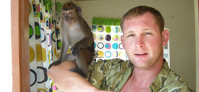 That was a photo of me and my pet monkey in the Philippines. I tried to reintroduce it to other monkeys shortly after I bought it, [but] the other monkeys won't have anything to do with her. So, she's kind of like an outsider. So, we got along pretty well, and as long as I was relaxed, she was relaxed. I learned a lot of neat lessons from having that monkey around; patience and self-control, mostly.