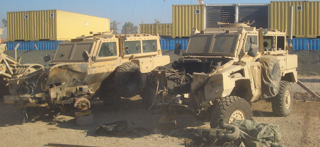 Probably the worst part of the job was vehicle recovery. We’d have to pick up these vehicles like Humvees that had been hit by IEDs and VBIEDs [Vehicle Borne IEDs] and put them on the back of the trucks. And most of the time they’d be covered up already, but on occasion they’d still be hot from the explosion, too hot to touch, and you can smell the burning flesh on the seats and everything. I can still smell it to this day, just talking about it.