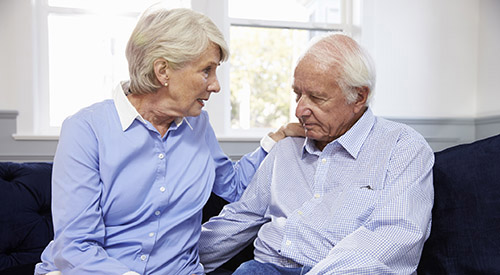 Elderly couple where concerned wife talking to her husband