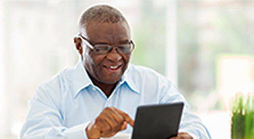 Older man working on a tablet