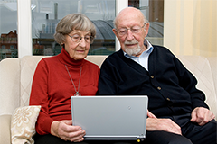 older couple looking at a computer