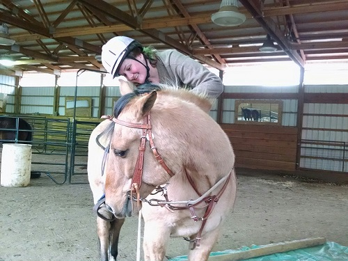 Army Veteran Katie Hudgin and her favorite horse, Diesel