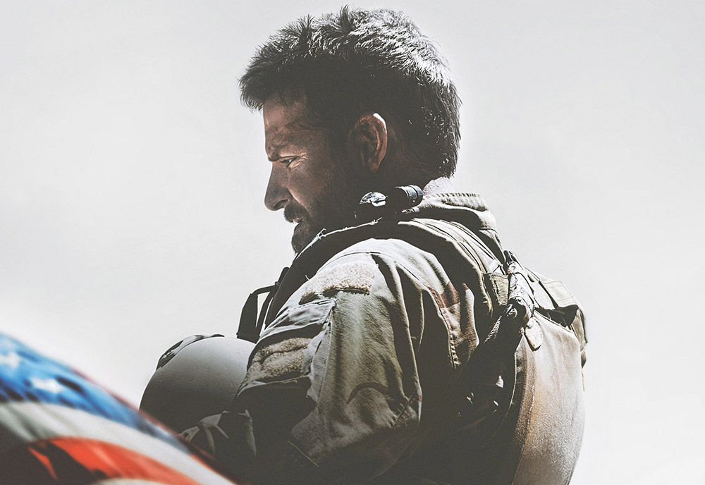 a soldier in profile by a U.S. flag