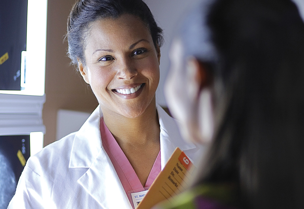 A female doctor speaking with a female patient about her heart health