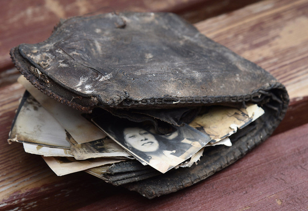 An old wallet with photos sticking out
