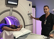 U.S. Army Veteran Jim Altman receives lung cancer screening facilitated by CT Technologist, Miguel Santiago at the C.W. Bill Young VA Medical Center.