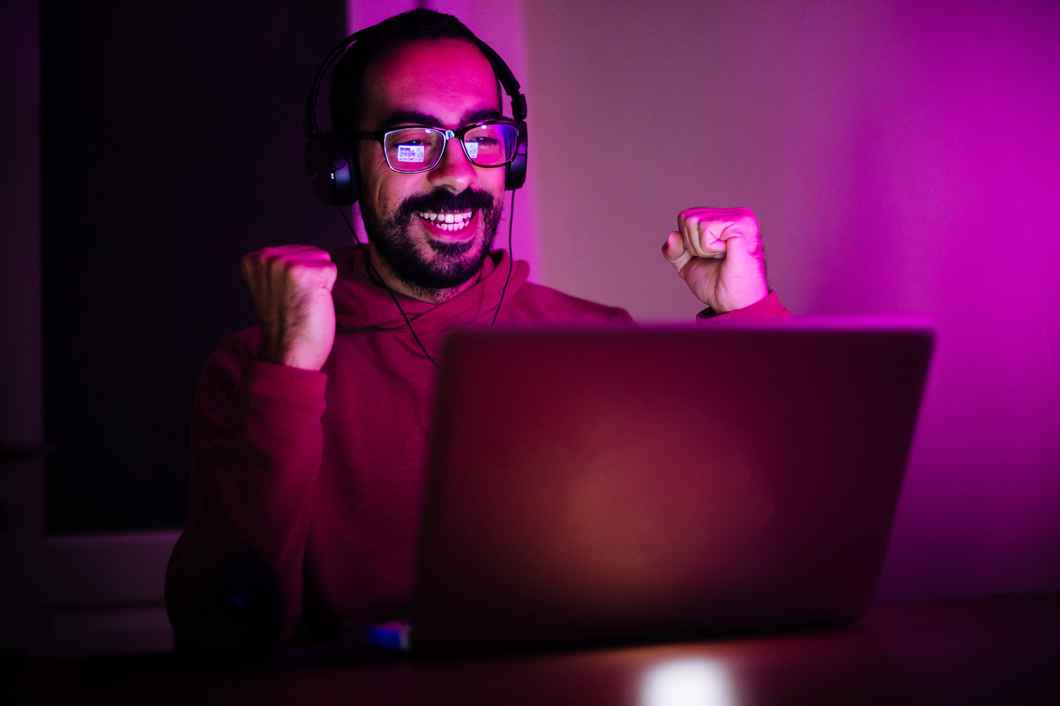 man excited in front of a computer screen