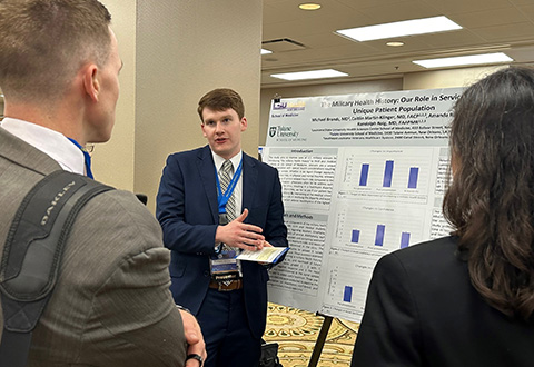 Health Professions Trainee Dr. Michael Brands presents a research poster at the Designated Education Officer Conference in Chicago, Aug. 23, 2023.