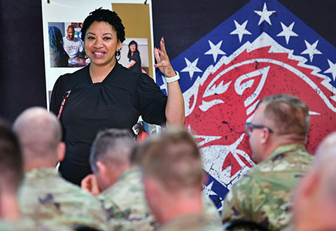 Lamanda Blackman, VA Whole Health pathway coordinator and coach, explains to National Guard members about VA benefits and eligibility.
