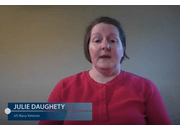 Woman in red shirt speaking to camera with name displayed Julie Daughety Navy Veteran