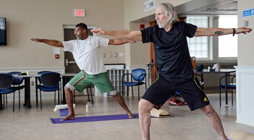 two veterans doing yoga