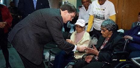 Secretary Wilkie presents a VA coin to (PFC) Maybelle Campbell, member of the 6888th Central Postal Directory Battalion